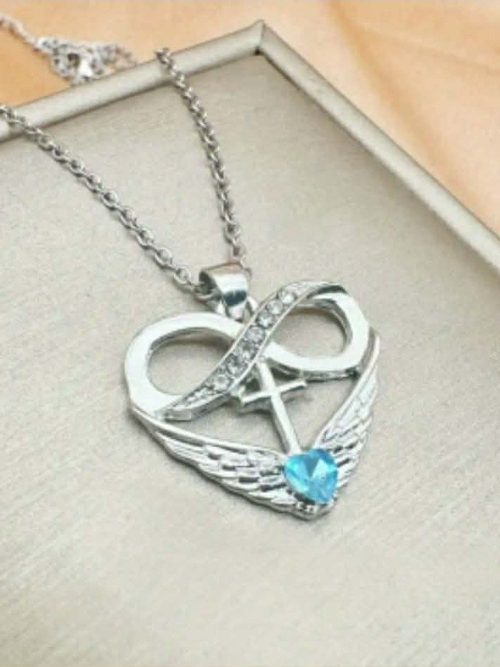 NWOT Stainless Silver Infinity Heart Pendant Necklace with Blue Crystal.